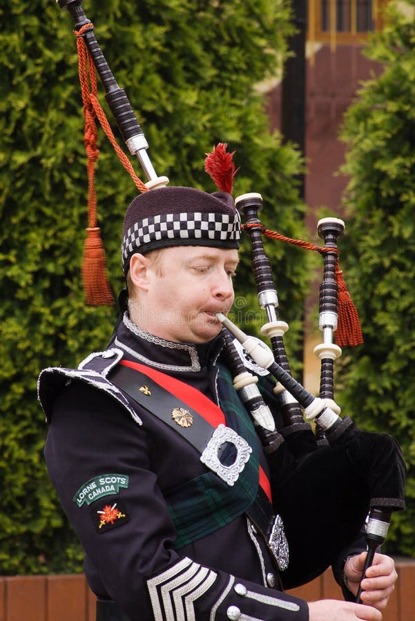 RADZIONKOW - 2009 MAY 30: the show of drums and pipes? scottish music group during military rally cars.30 may 2009 in Radzionkow, Poland. RADZIONKOW - 2009 MAY 30: the show of drums and pipes? scottish music group during military rally cars.30 may 2009 in Radzionkow, Poland