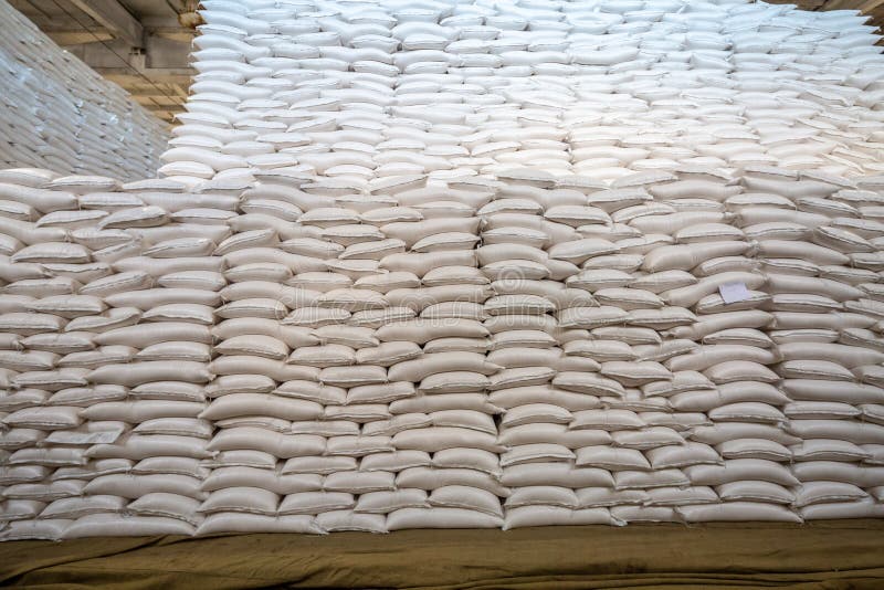 Bags of Sugar in the Warehouse. a Wall of Sugar Sacks in a Large