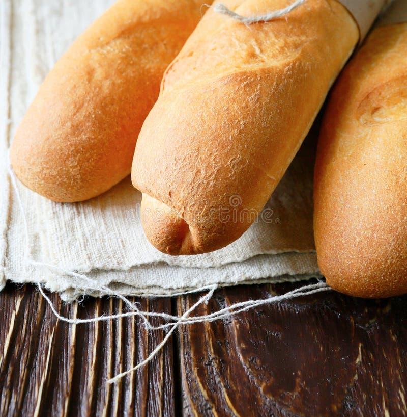 Baguette drie op hennepdoek stock foto Baguette drie op hennepdoek stock foto