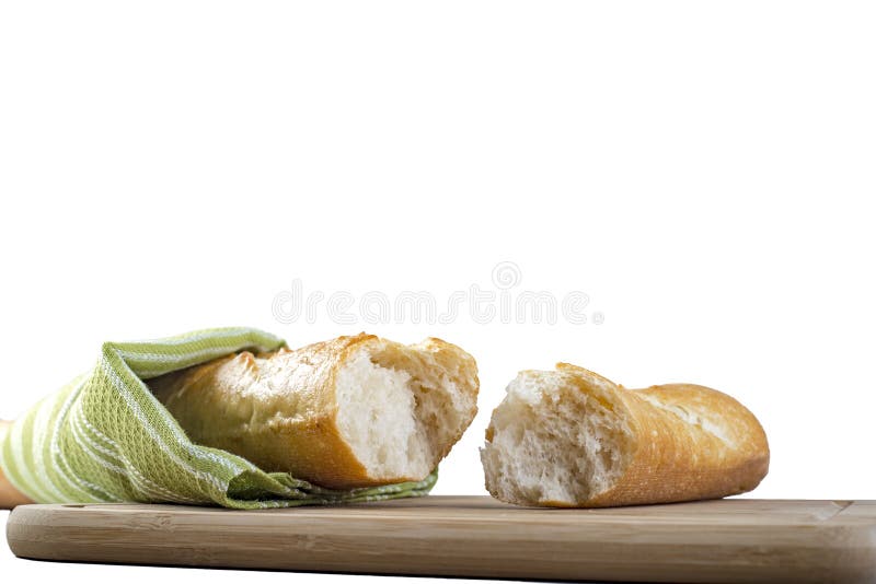Baguette largo roto en pedazos en el fondo blanco imagenes de archivo Baguette largo roto en pedazos en el fondo blanco imagenes de archivo