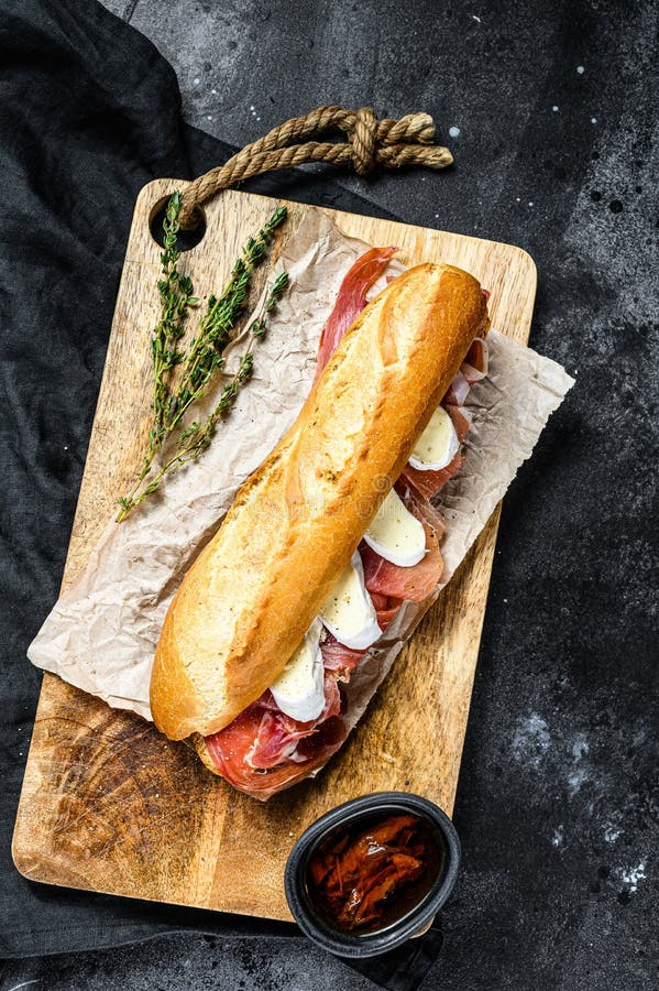 Baguette Sandwich with Prosciutto Ham, Camembert Cheese on a Cutting ...