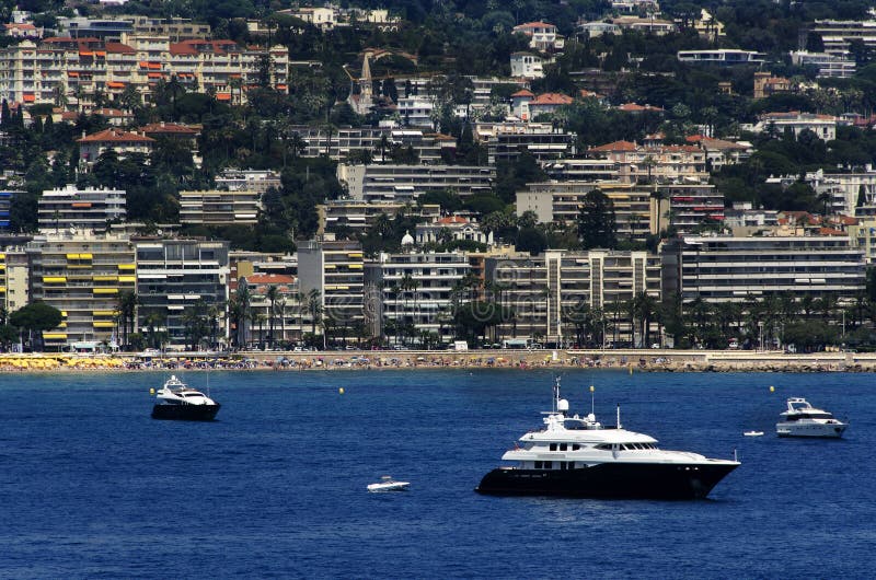 Famous bay of Cannes in France with the buildings and yachts . Famous bay of Cannes in France with the buildings and yachts .