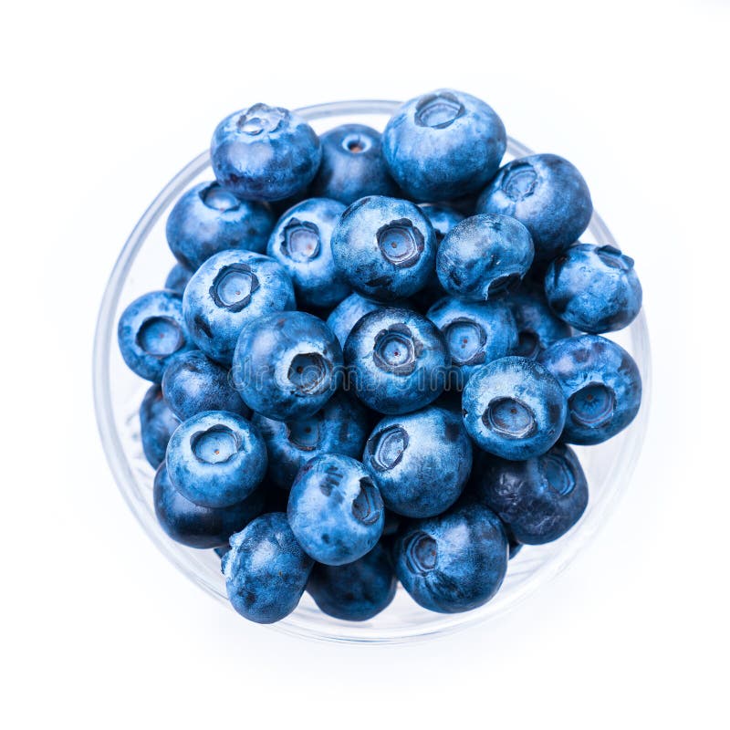 Blue berries in a glass cup, isolated on white. Blue berries in a glass cup, isolated on white