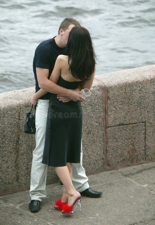 Kissing couple on the bank of Neva river. Kissing couple on the bank of Neva river