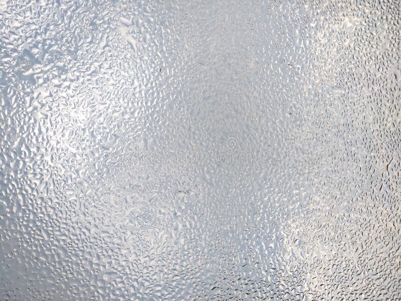 Baisses abstraites de l'eau de fond sur le verre photos stock Baisses abstraites de l'eau de fond sur le verre photos stock