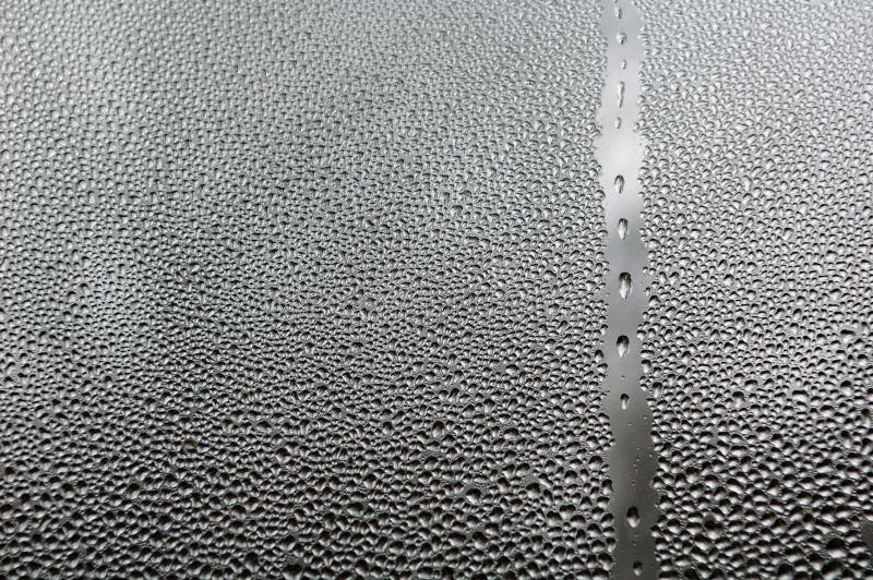 Water drops on glass close up. Water drops on glass close up