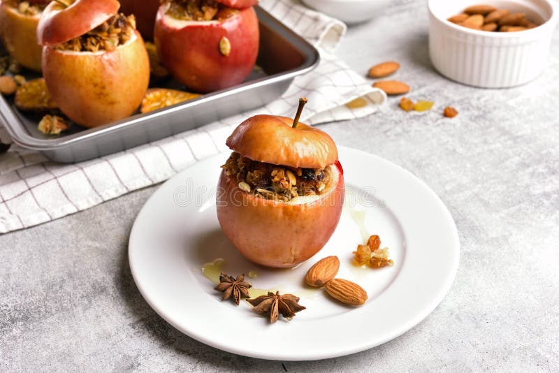 Baked Apples with Granola, Cinnamon, Nuts and Honey Stock Photo - Image ...