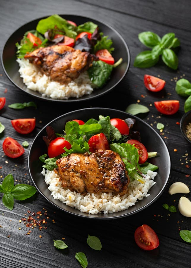 Baked Balsamic Chicken Thighs with Rice and Vegetables Stock Image