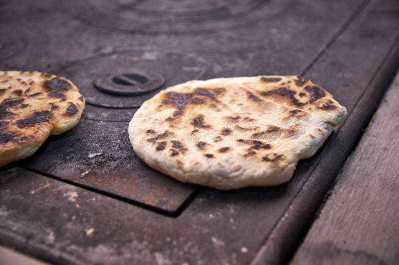 Baked bread on the stove 2 stock photo. Image of chef 276317570