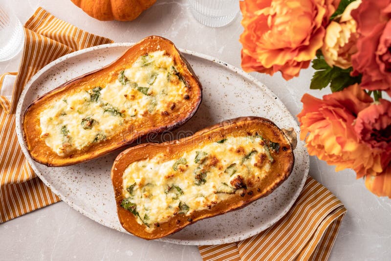 Baked Butternut Squash Stuffed with Spinach and Cheese Stock Image