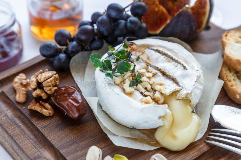 Camembert Cheese with Figs, Honey and Wine. Selective Focus Stock Photo