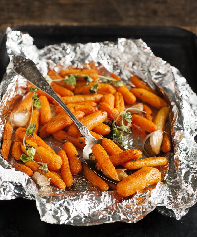 Baked carrots with garlic and oregano royalty free stock images