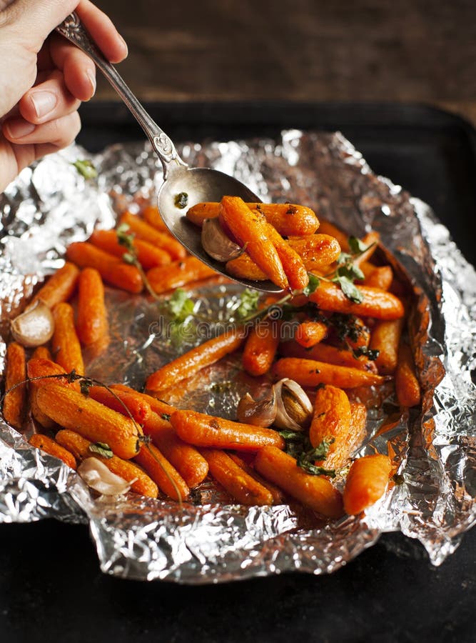 Baked carrots with garlic and oregano royalty free stock photos
