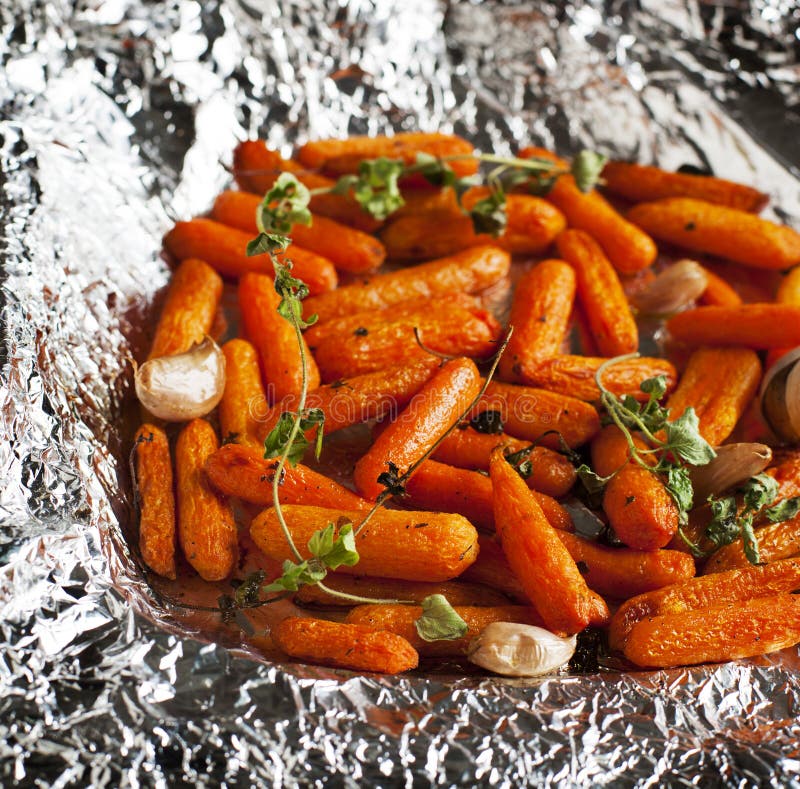 Baked carrots with garlic and oregano royalty free stock images