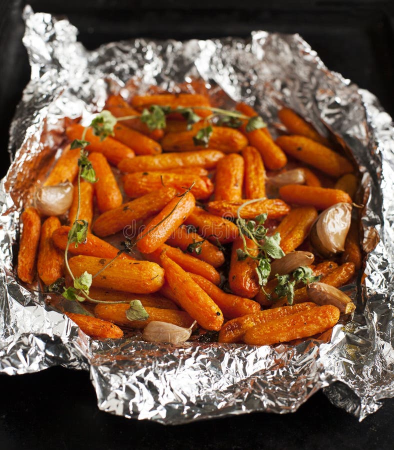 Baked carrots with garlic and oregano royalty free stock photo