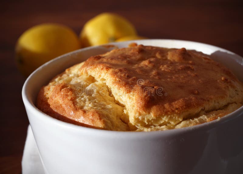 Baked cheese soufflé portion in a ramekin