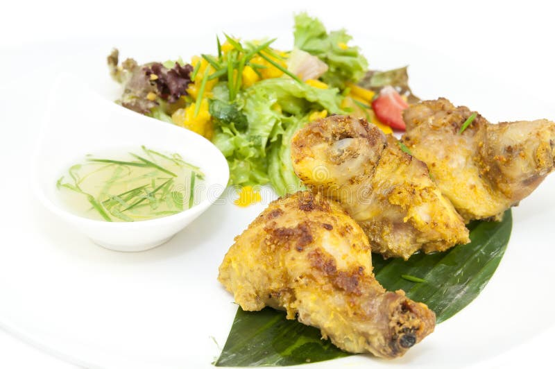 Baked chicken in curry sauce stock image