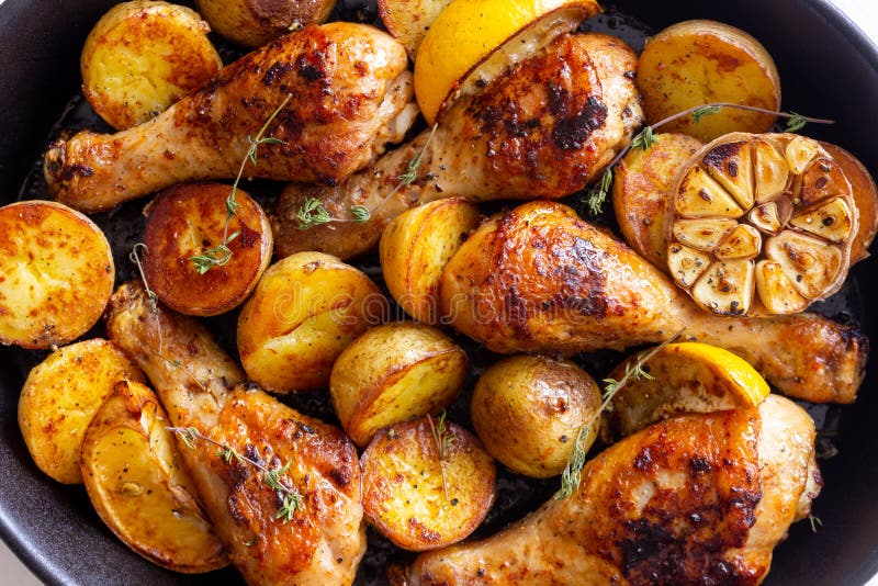 Baked Chicken Legs with Potatoes and Lemon. Recipe Stock Photo Image