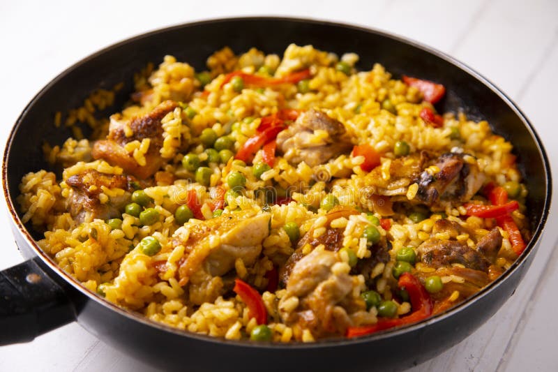 Baked Chicken Rice Paella with Vegetables. Traditional Spanish Recipe