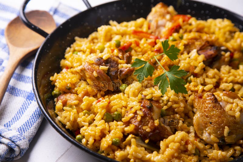 Baked Chicken Rice Paella with Vegetables. Traditional Spanish Recipe