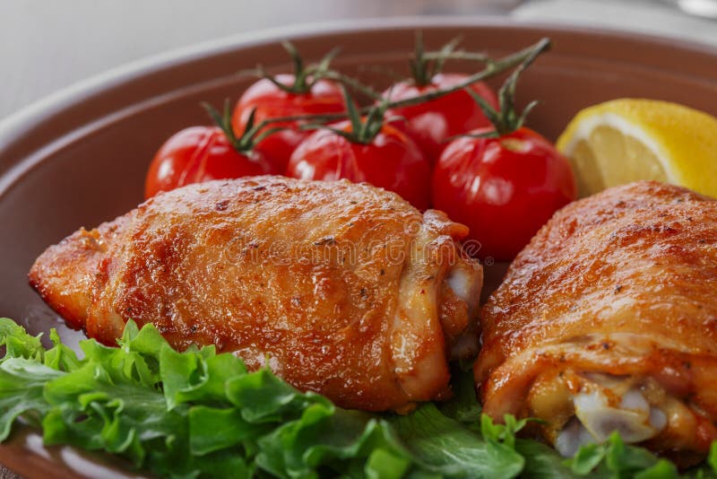 Baked chicken thigh stock image. Image of fried, plate - 49632557
