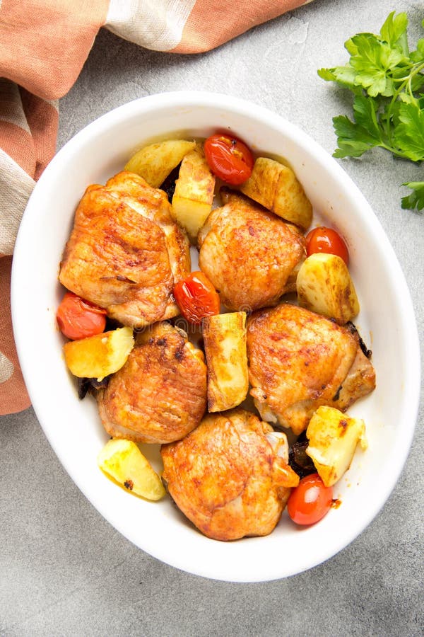 Baked Chicken Thighs (legs) with Crispy Crust, Potatoes and Cherry