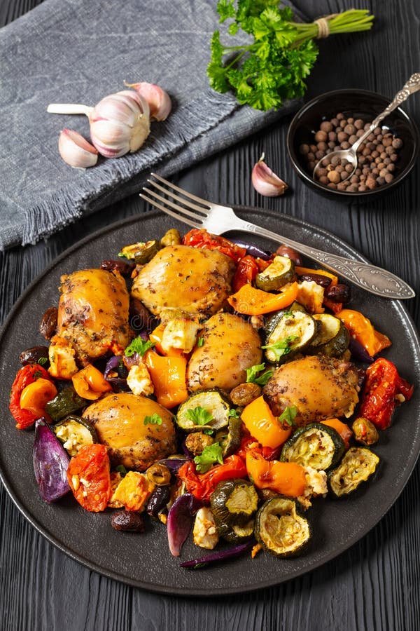 Baked Chicken Thighs with Veggies, Olives, Feta Stock Image - Image of
