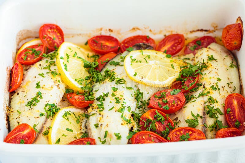 Baked Cod Fillet with Cherry Tomatoes and Butter Stock Image - Image of