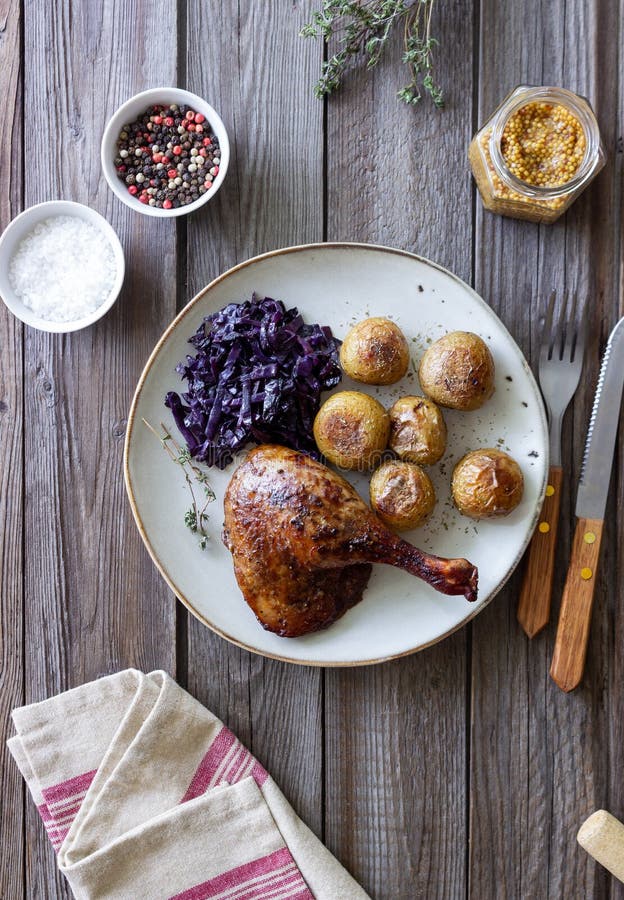 Baked Duck Leg with Potatoes and Red Cabbage Stock Photo Image of