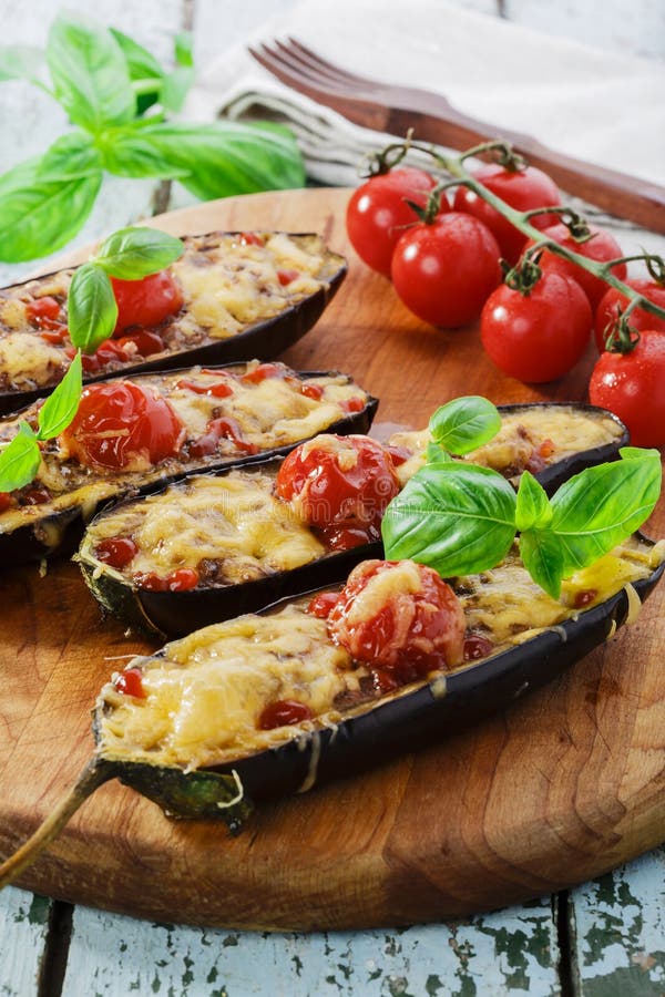 Baked Eggplant with Cheese on a Dark Wooden Table. Parmigiana Melanzane