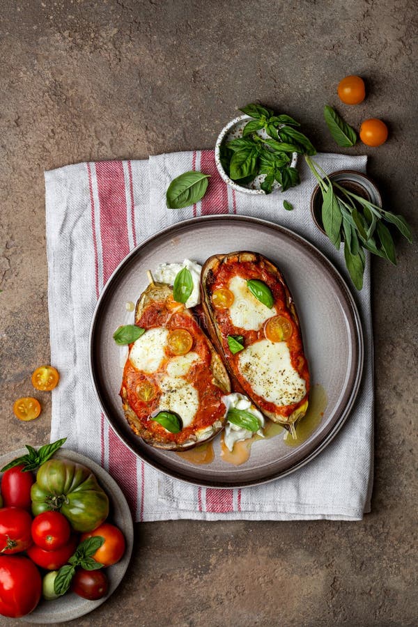 Baked Eggplant with Mozzarella Cheese, Tomatoes and Basil Stock Photo