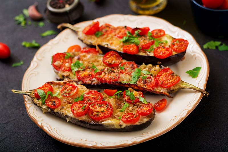 Baked Eggplants with Mozzarella and Tomatoes with Italian Herbs Stock ...