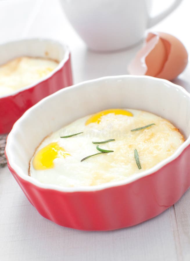 Baked eggs breakfast with herbs