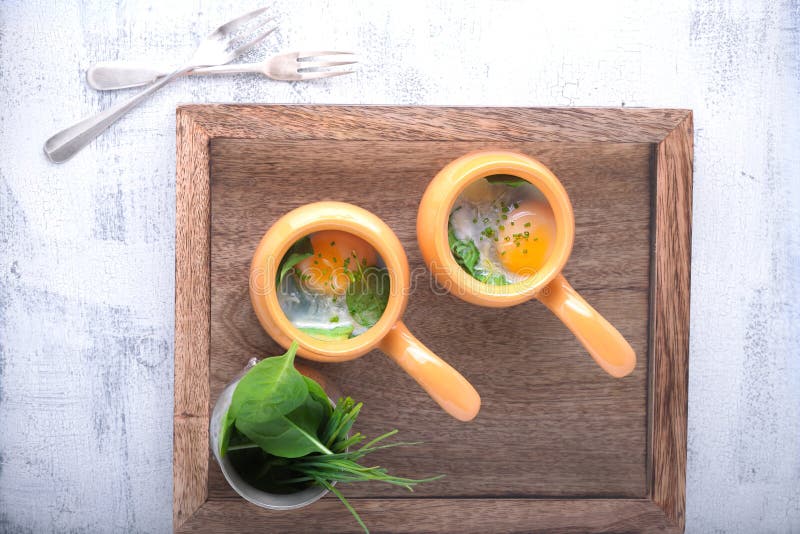 Baked eggs with spinach stock photo. Image of parmesan 92838806