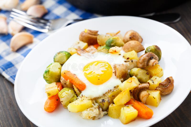 Baked Eggs with Vegetables and Mushrooms Stock Photo - Image of table