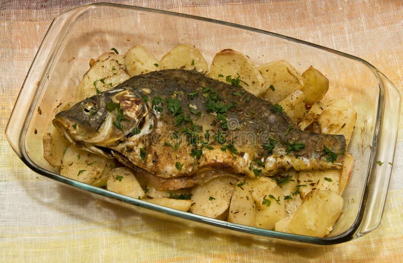 Baked fish and potatoes stock image. Image of ingredients 27376373