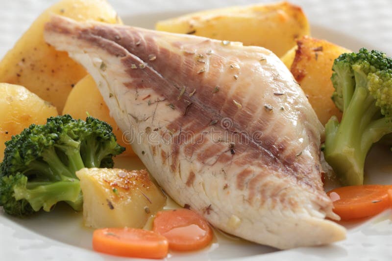 Baked fish with vegetables stock image. Image of gastronomy 27852115
