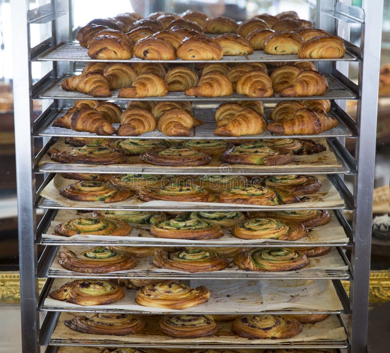 Baked Goods Cooling on a Bakery Rack Stock Photo Image of meal, gold