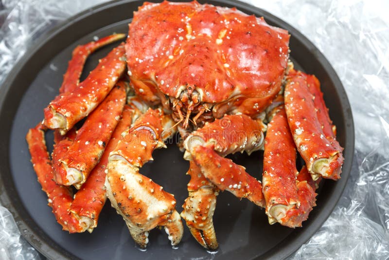 Baked Kamchatka Crab Whole on a Black Plate. Stock Image Image of