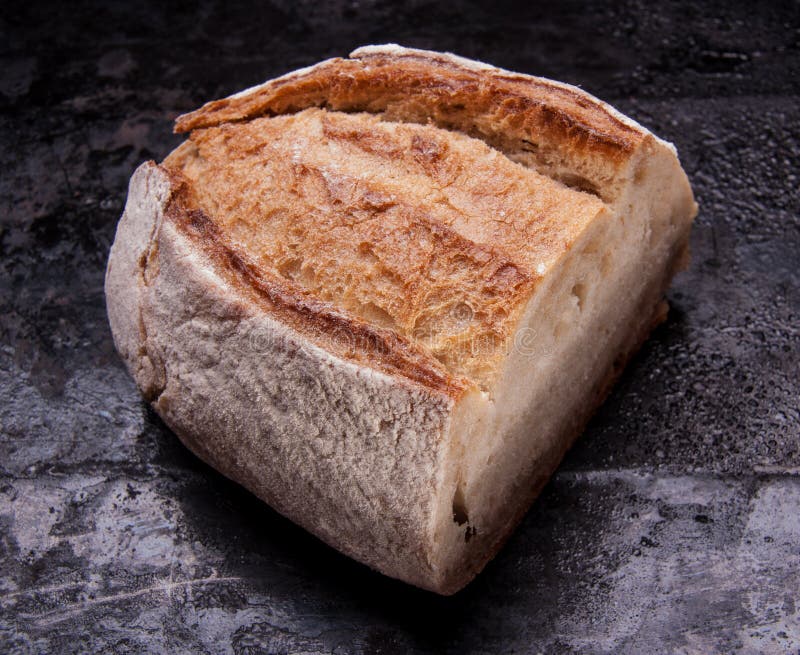 Baked Loaf on Black Baking Tray. Country House Style Stock Photo