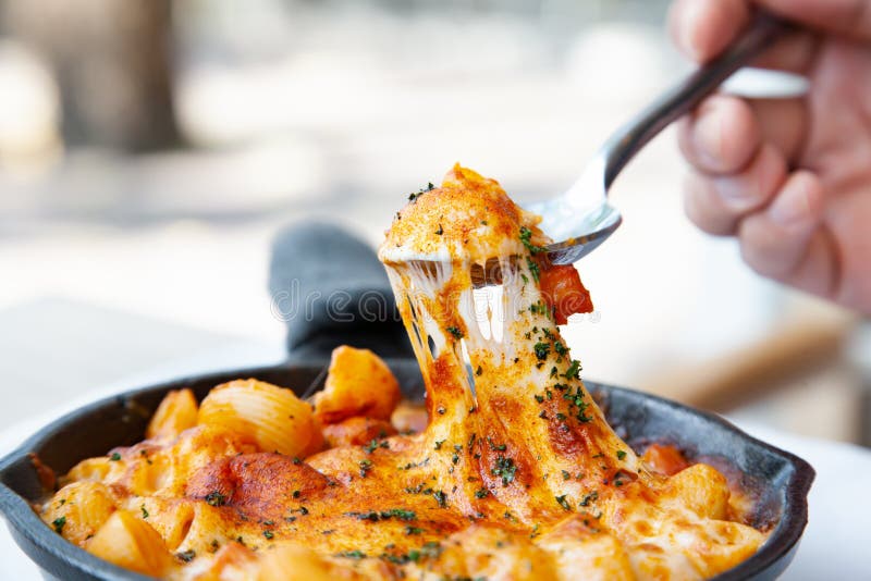 Baked Macaroni and Cheese with Fresh Tomato Sauce Served on Hot Pan