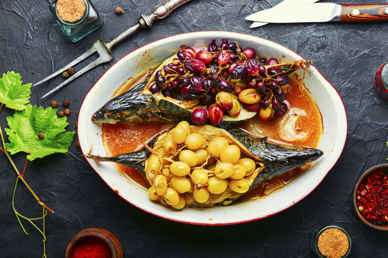 Baked mackerel with grapes stock photo. Image of dish 200603878