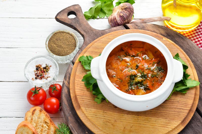 Baked meat with potatoes and vegetables in a bowl. Ukrainian traditional cuisine. Top view. Free space for your text royalty free stock photography Baked meat with potatoes and vegetables in a bowl. Ukrainian traditional cuisine. Top view. Free space for your text royalty free stock photography
