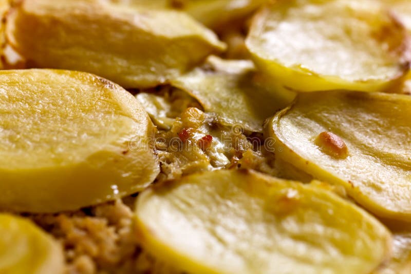 Baked moussaka dish on a wooden board stock photo Baked moussaka dish on a wooden board stock photo