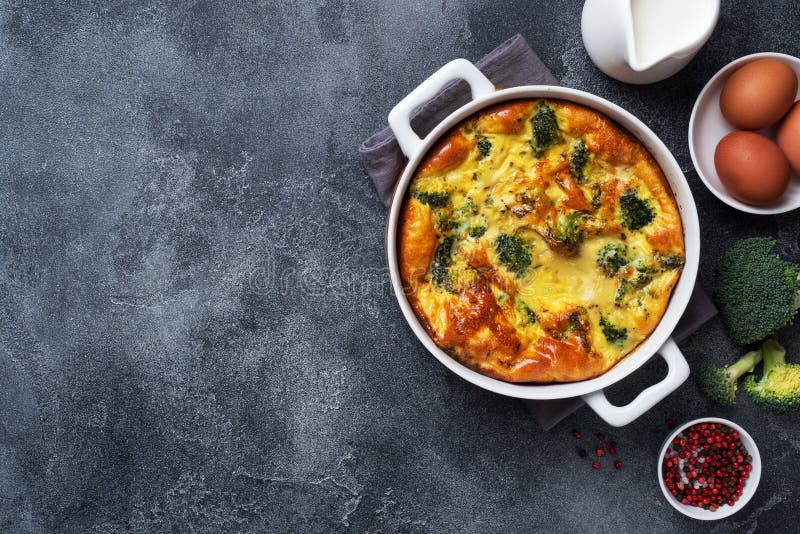 Baked Omelet With Broccoli In A Ceramic Dish. Dark Concrete Table. Copy Space. Healthy Diet Food Dish