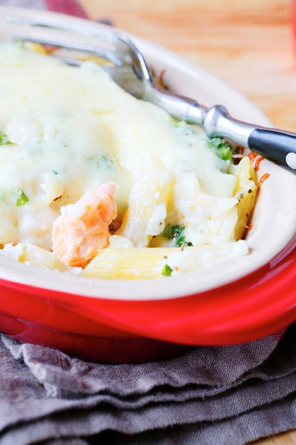 Baked pasta with cheese sauce with fish