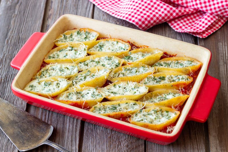 Baked Pasta Stuffed with Cheese and Spinach in Tomato Sauce. Vegetarian