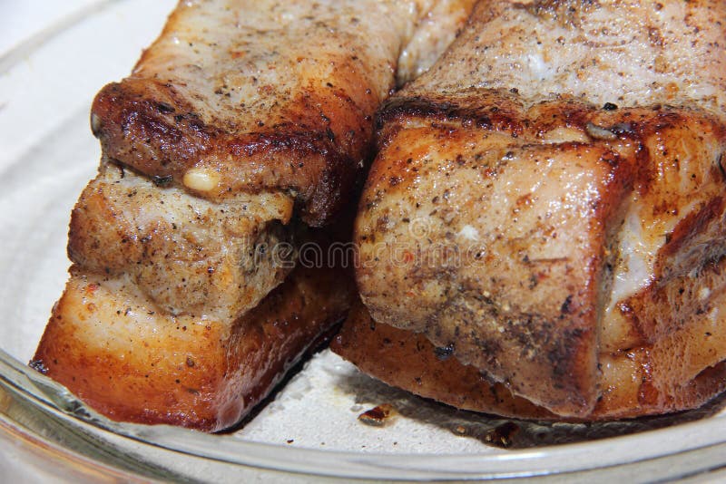 Baked Piece Of Pork Meat On Aluminum Foil, The Process Of Cooking Meat Dishes In The Oven. Stock ...