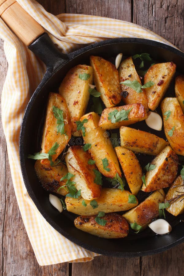Baked Potato with Garlic in a Pan Top View Vertical Stock Photo Image