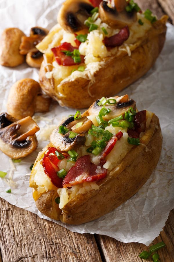 Baked Potato Stuffed with Bacon, Mushrooms and Cheese Closeup. Stock Photo Image of closeup